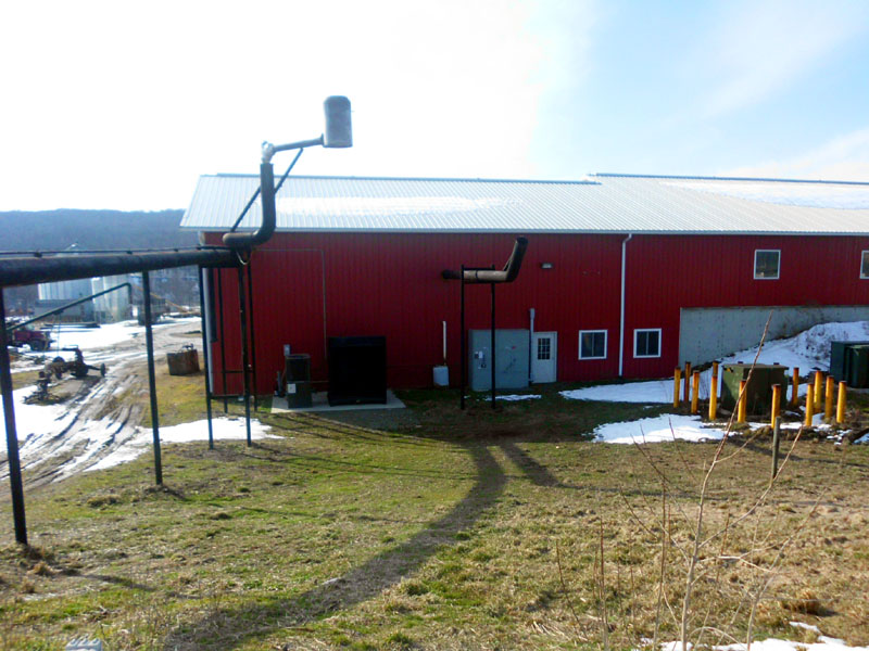 anaerobic digester equipment near red building