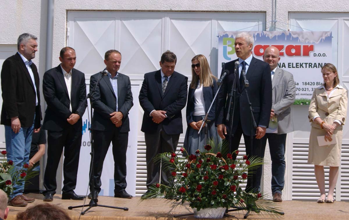 Group of people celebrating inauguration of new Serbian of biogas plant