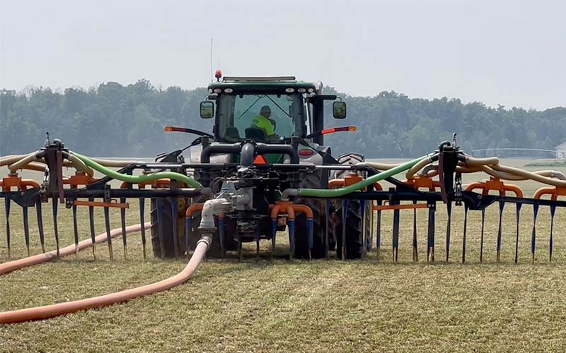 tractor spreading manure slurry