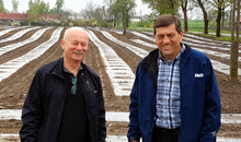 two men smiling at the camera